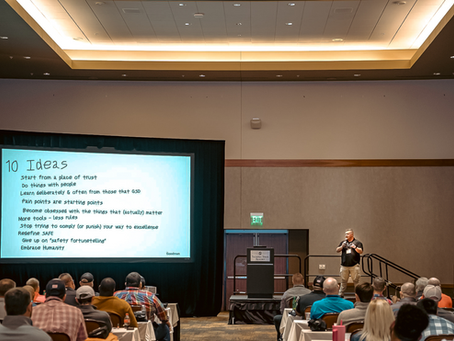 Globally recognized HOP expert delivering a keynote on operationalizing Human & Organizational Performance in front of large group of engaged people.