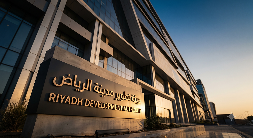 A wide-angle shot from ground level looking up at a modern Riyadh building façade at magic hour — a large bilingual Arabic and English brand identity panel in the foreground catching warm light against the building's shadow — capturing the scale and momentum of Saudi Arabia's brand and design transformation under Vision 2030.