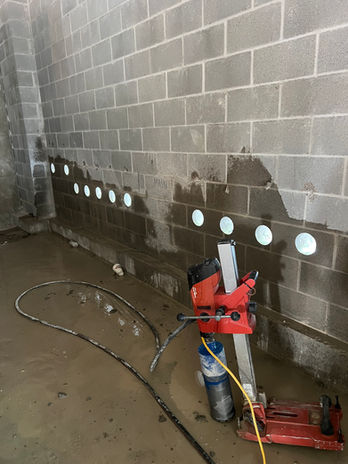 horizontal core drilling on CMU wall for electricians