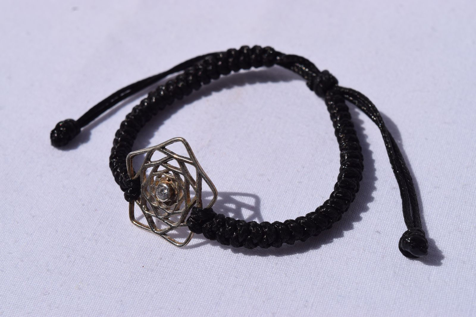 Pulsera Pentaflor tejida negra