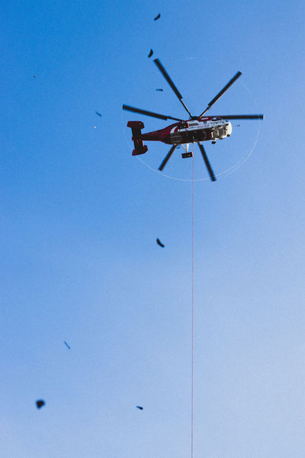 Minimalist travel photography helicopter in blue sky Zurich Studio Barco