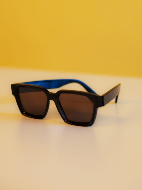 Black square frames on yellow background eyewear photography Studio Barco