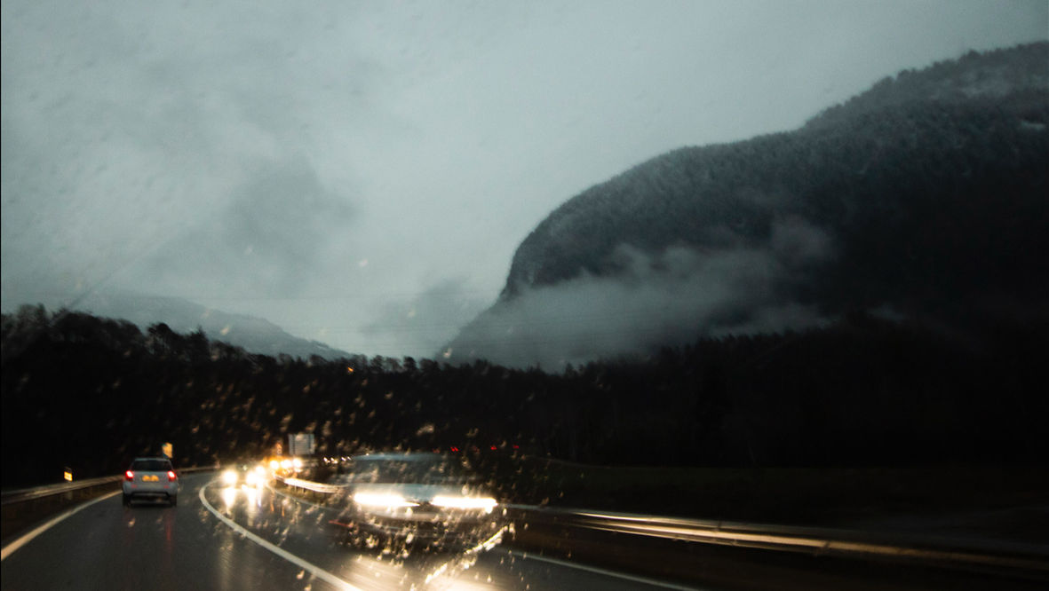 Cinematic travel photography rainy highway and mountains Zurich Studio Barco
