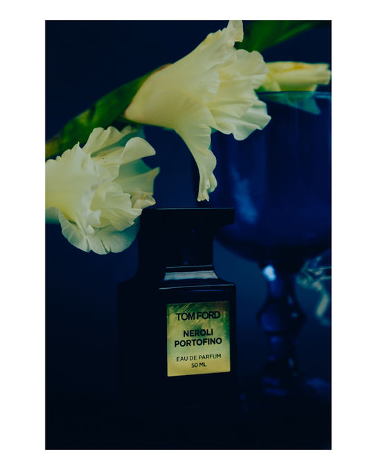 Luxury perfume bottle still life photography with white flowers Zurich Studio Barco