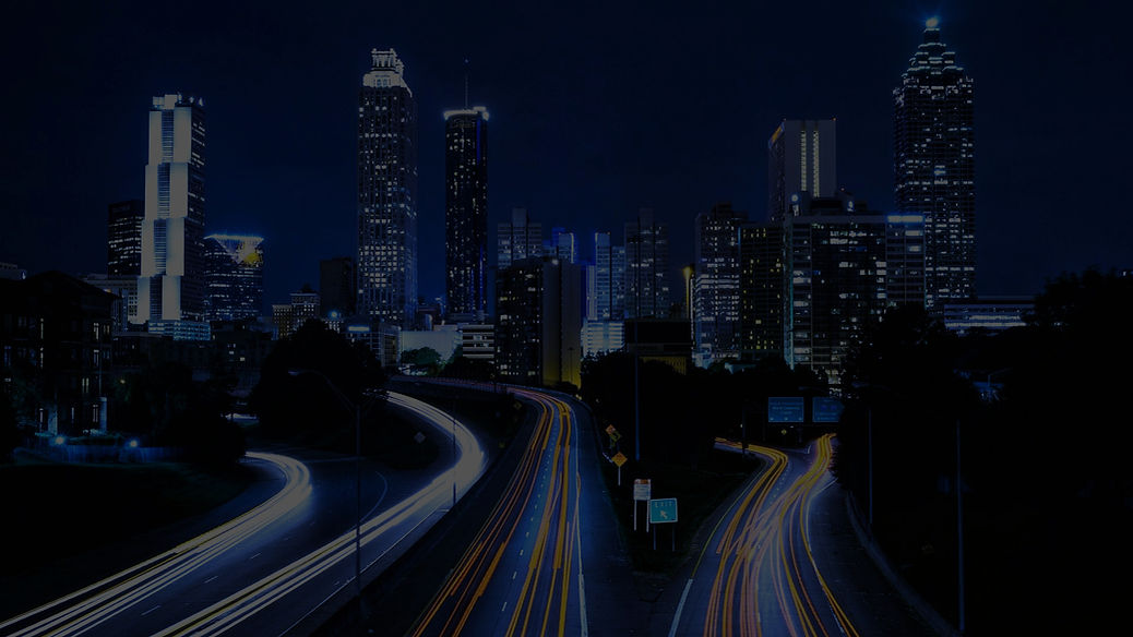 Nighttime cityscape showing modern skyscrapers and illuminated streets, symbolizing progress and innovation, reflecting Netmarks Indonesia's commitment to driving digital transformation.