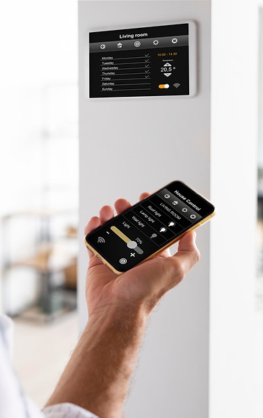 person-using-smartphone-in-his-automated-home.jpeg