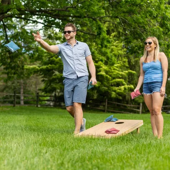 Cornhole Game at Backyard Party