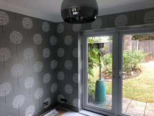 a medium sized with with grey wallpaper