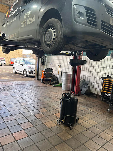 vehicle raised for service and MOT