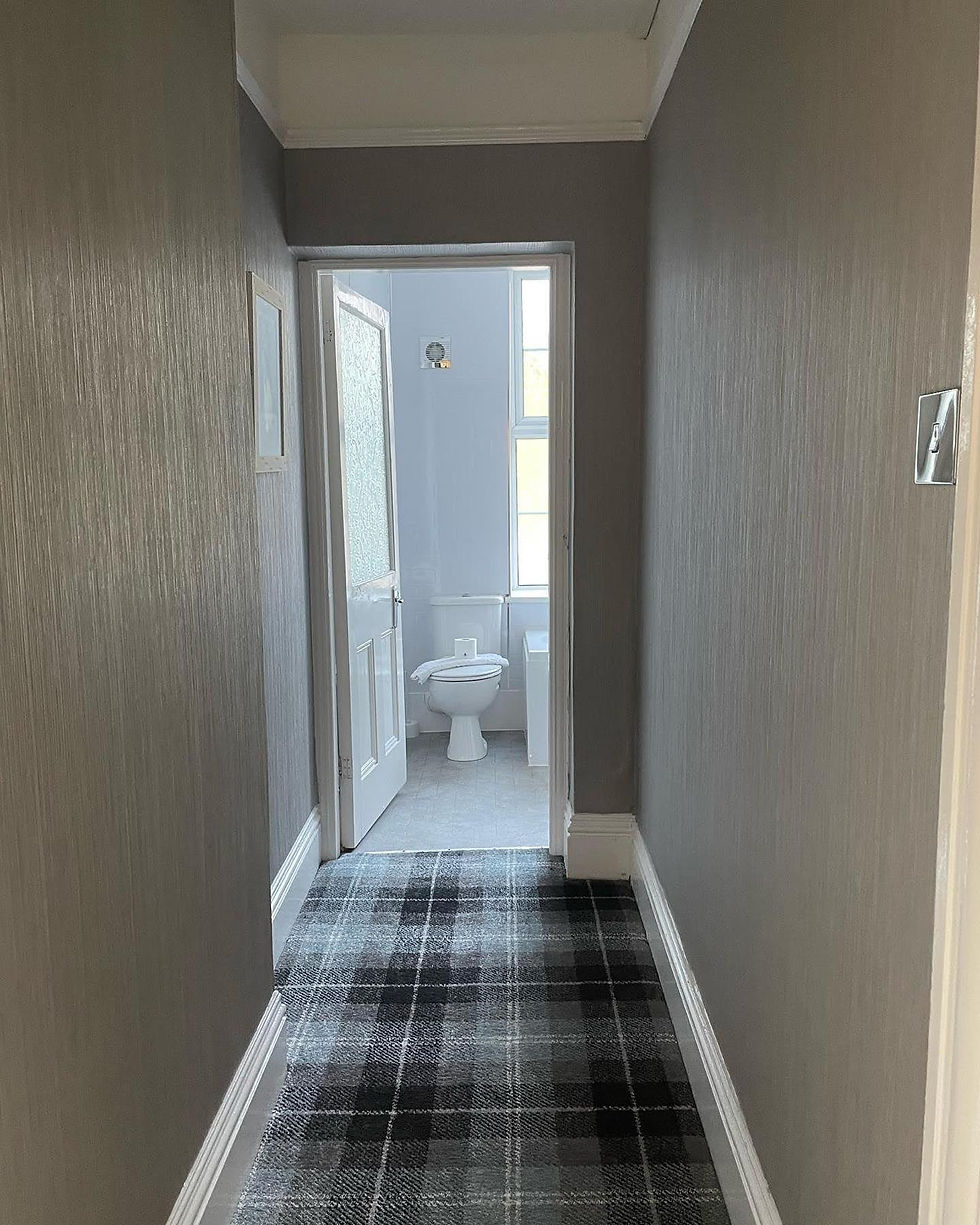 corridor leading to bathroom