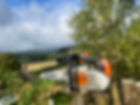 Landscape with tree surgeon equipment focussed