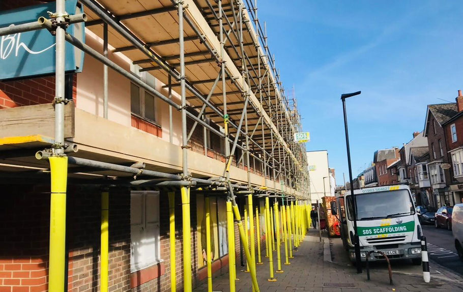 scaffolding for high street next to company van