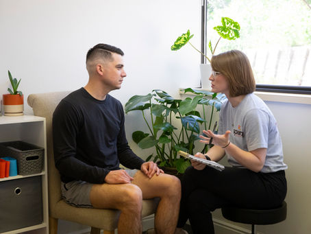 Sparq Physical Therapist taking history of a patient.