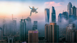 Do we weigh less at the skyscraper's top? Gravity and altitude
