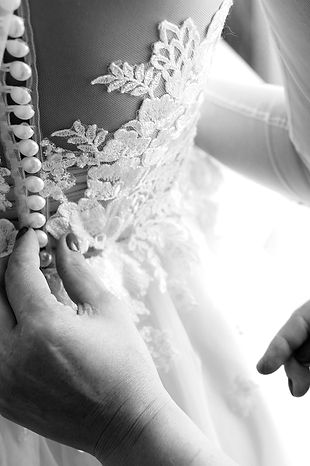 Buttoning Up a Wedding Dress_edited.jpg