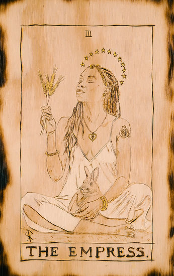 A barefoot woman sits in the grass with a rabbit in her lap, radiating calm, sensuality, and deep connection to nature.