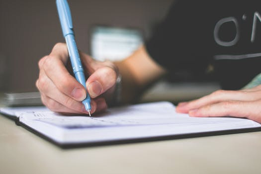 image of a person writing