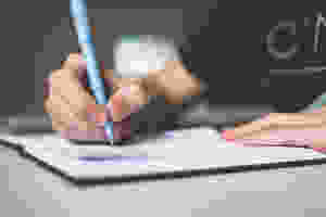 image of a person writing