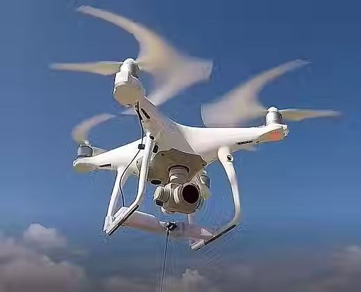 DJI Phantom 3 drone with Drone Sky Hook payload and release system