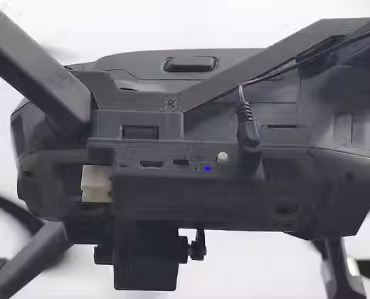 Back side view of the DJI Mavic 2 drone with drone sky hook payload release and drop mechansim attached to it