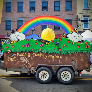 a parade float with a rainbow theme