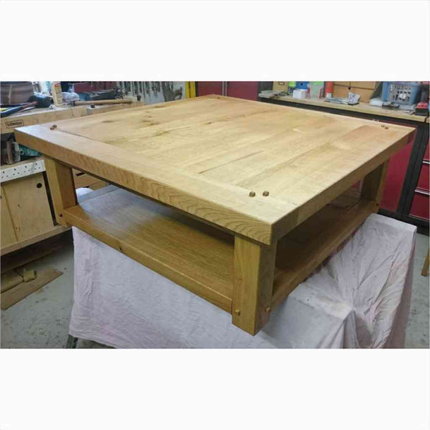 Close-up view of the decorative and functional wooden pegs on the Thurkill table