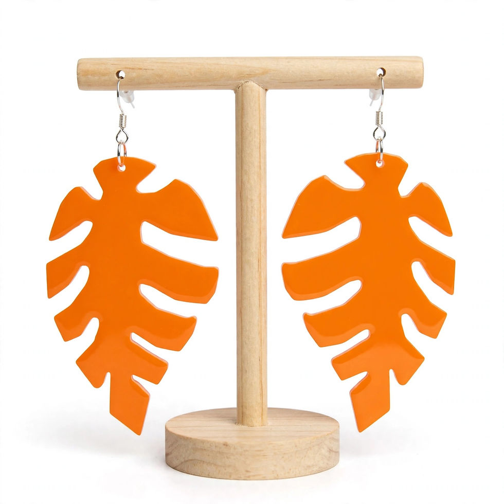 Thumbnail: Woman wearing Verdelune Monstera tropical earrings for boho festival summer fashion