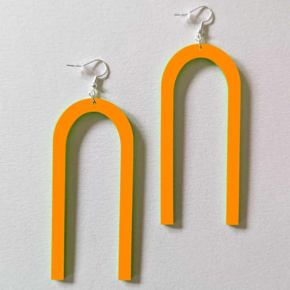 Thumbnail: Orange Acrylic U-Shaped Dangle Earrings a long, sleek laser-cut geometric horseshoe design on silver hooks.