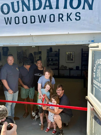 people cutting a ribbon for business opening