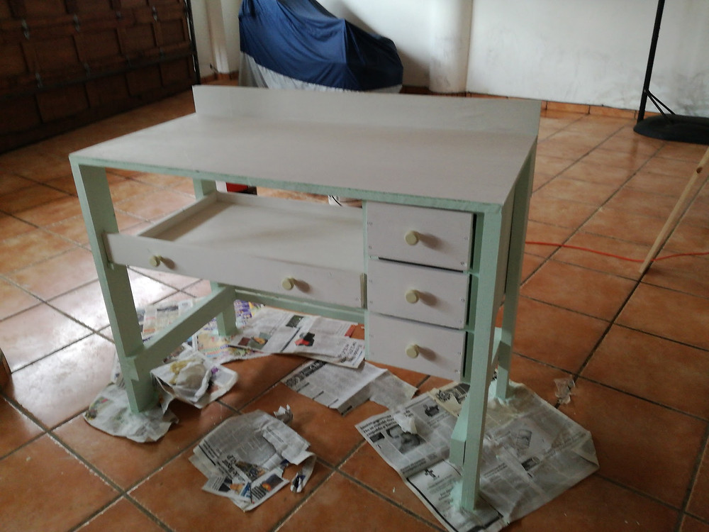 Picture of my minty-green jeweler's bench I made to being learning jewelry making.
