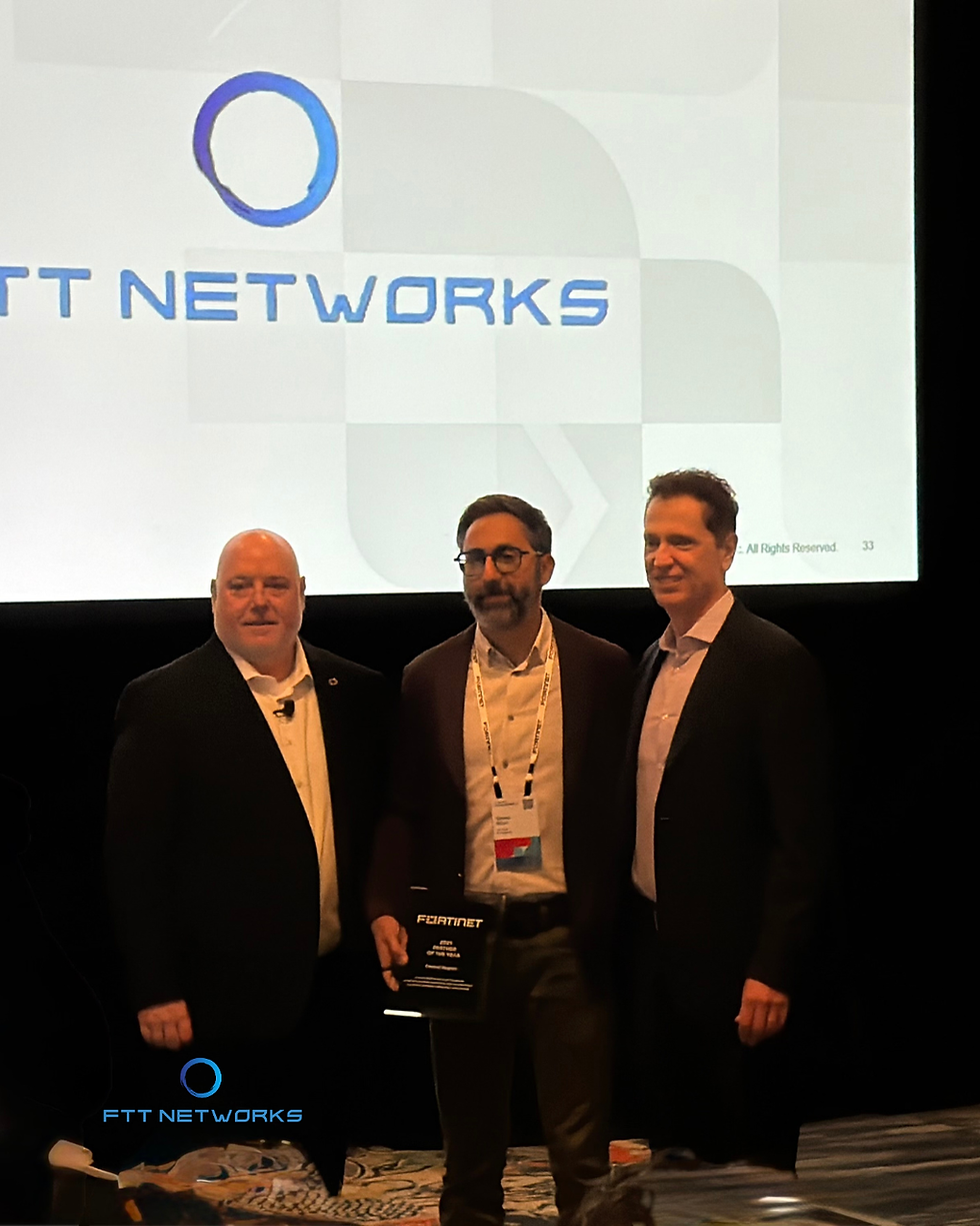 Saeed from FTT Networks accepting the Fortinet 2025 Partner of the Year award.