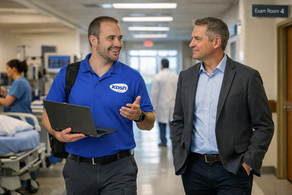 Kosh technician walking with Hospital executive