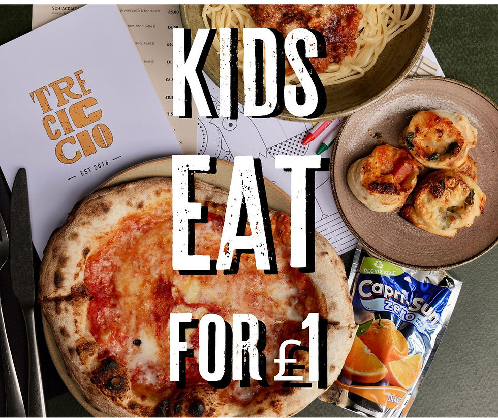 Pizza, pasta, and snacks on a table with a "Kids Eat for £1" promo text. A Capri-Sun pouch and menu visible. Cozy, inviting setting.