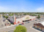 Aerial of the building front, parking and neighboring downtown buildings at 400 Follett Street, Lemoore