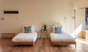 2 twin beds shared retreat bedroom for group stays at Gaia Villa