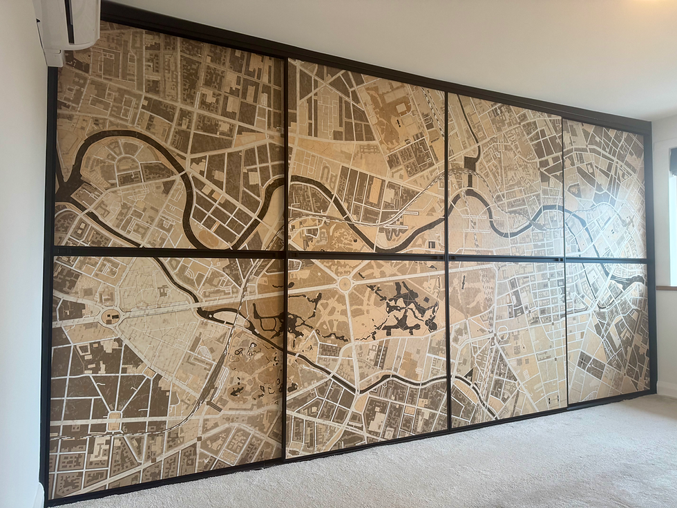 Berlin feature wallpaper on wardrobe doors.