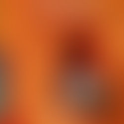 Orange wall with an arched niche, white flowers, and a lantern. Text reads "Small things get bigger." Mood is warm and uplifting.