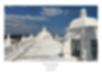 White domes of León Cathedral under a blue sky. People walk on the rooftop. Text reads "LEON CATHEDRAL, LEON, NICARAGUA."
