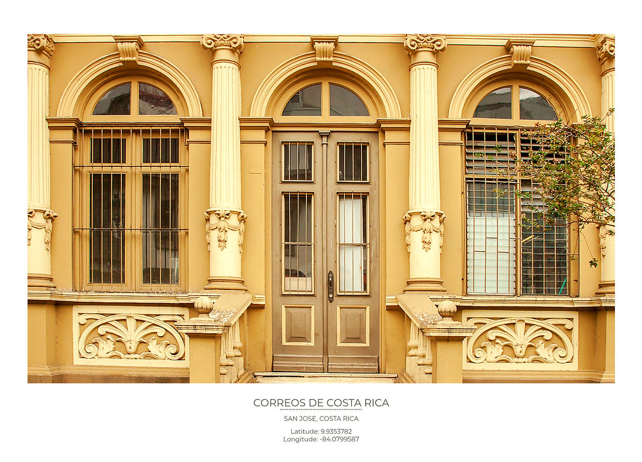 The Arched Entrance doors and yellow facade of the correos de Costa Rica