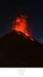 A volcano erupts at night, spewing bright red lava and sparks under a starry sky. Text reads: "Fuego Antigua, Antigua, Guatemala."