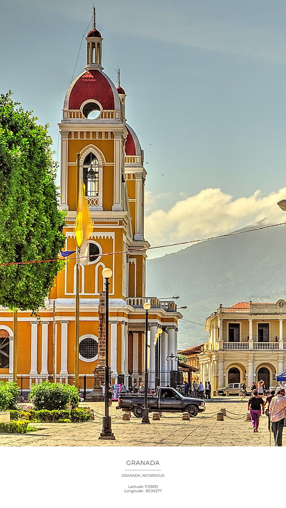 Yellow cathedral tower with red domes in Granada, Nicaragua. People walk nearby, and a truck is parked. Clear sky and mountains in background.