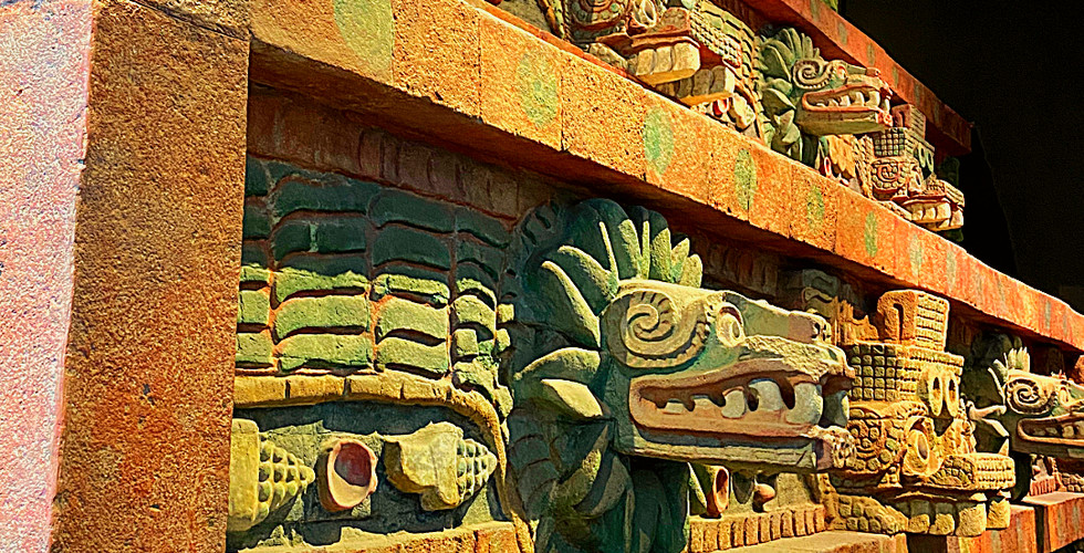 Colorful Tenochtitlan temple reconstruction with carved serpent motifs, displayed in a museum setting. Text: TENOCHTITLAN RECONSTRUCTION.