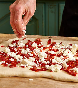 If you haven’t got forearms like an Italian mama or flour all over your face and in hair by the end of this day in our kitchen, you either haven’t enjoyed yourself or been worked hard enough.

What would a cookery school be without a proper pasta making and pizza baking course?

It’s simply fun to make either of these Italian wonders with friends or family. My children love rolling out the pasta and winding the handle on the pasta making machine to make tagliatelle. They make pizzas with their friends and these are just two dishes that make a happy kitchen table. These are skills for life and guess what. They are wonderfully fun to teach and easy to learn.

Having been on enough pasta making and woodfired pizza baking courses, we think we have devised a rather better one than Course than our more expensive competition has to offer.

Why is ours better one might ask? Well, the dough we make is the same beautiful dough that Miranda introduced to the family-run Firehouse Somerset opposite. The pizzas renowned across Somerset. The dough is a proper Neapolitan dough, made three days before it is rolled and broken. And, the toppings are sourced by the best Italian supplier from wonderful producers across Italy.

How can you make the dough three days before this course one might ask?

Well you don’t. You use our dough that is 3 days old and we use you as slave labour to make the next dough… but it’s worth it. You will see.

You don’t just make pizza dough. You will also make a traditional focaccia bread. You will learn the history of focaccia, how to knead, fold, roll and stuff the bread too with some delicious Italian ingredients.

We will talk about ingredients, including best flours to use for pizza, pasta and focaccia. You will learn a little about mozzarella, and taste some of our locally made Mozarella Di Buffula. You will make two seasonal, fresh Italian sauces to go with your pasta. You will also make tortelloni or ravioli with a lovely filling and a crispy sage and brown butter sauce to finish.

You will learn to roll, and fold pizza dough. The hydration techniques and flour strengths to get the best looking pizza in town. You will learn to break a pizza dough and we will have various toppings to try from our wonderful Italian supplier in Clevedon. You will get to go and visit our beautiful woodfired oven and watch our pizza boys in action across the road. You will enjoy your pizzas for lunch and take your pasta and sauces home for supper.

Mama mia what a day out we have in store for you.

Lunch included
Price: £200 per person
Enquire with Miranda on 07899665635. Dates must be agreed and booked in advance.