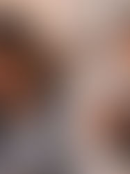 Upset woman sitting on bed in a fight with her husband.