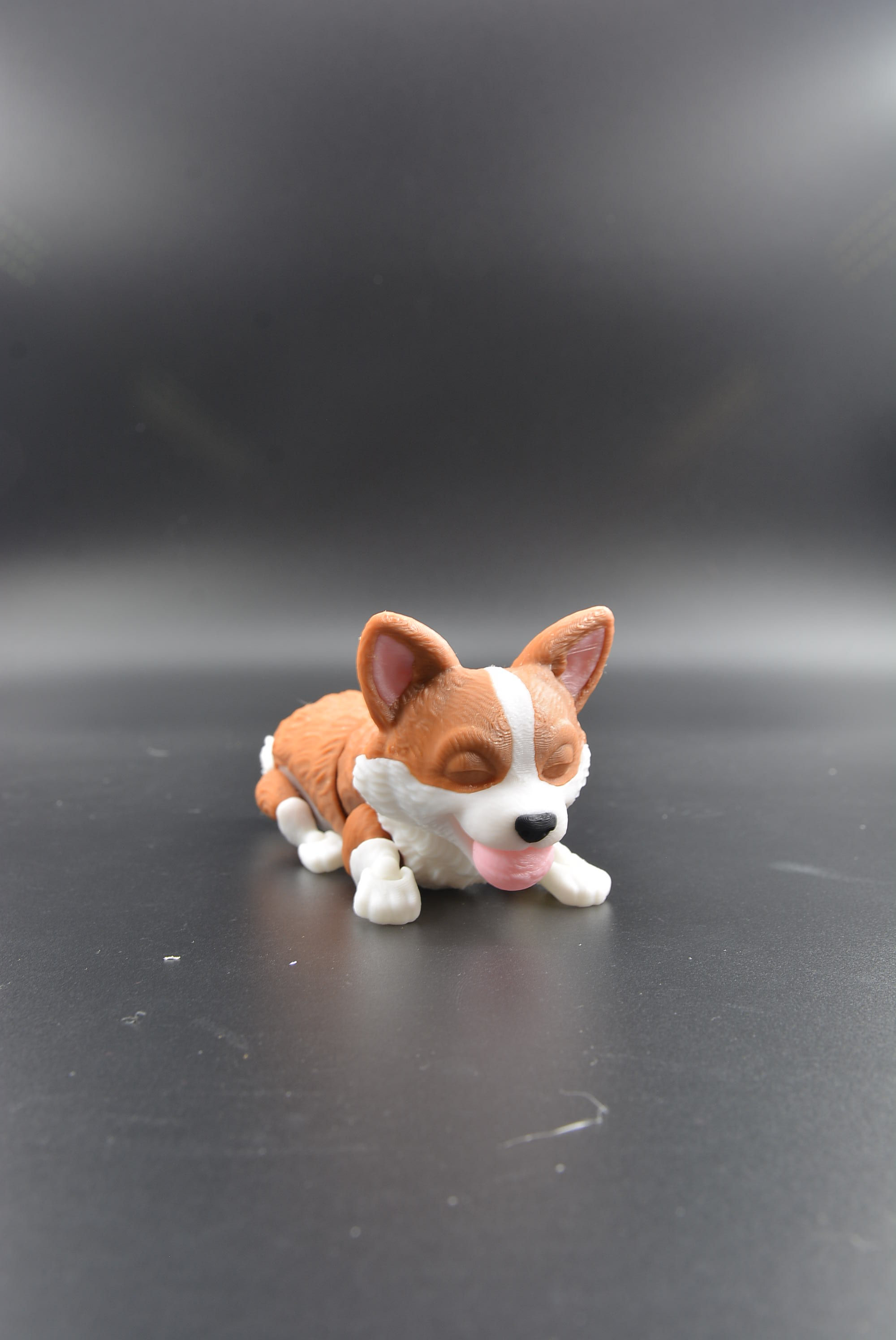 3D printed corgi flexi holding a small ball