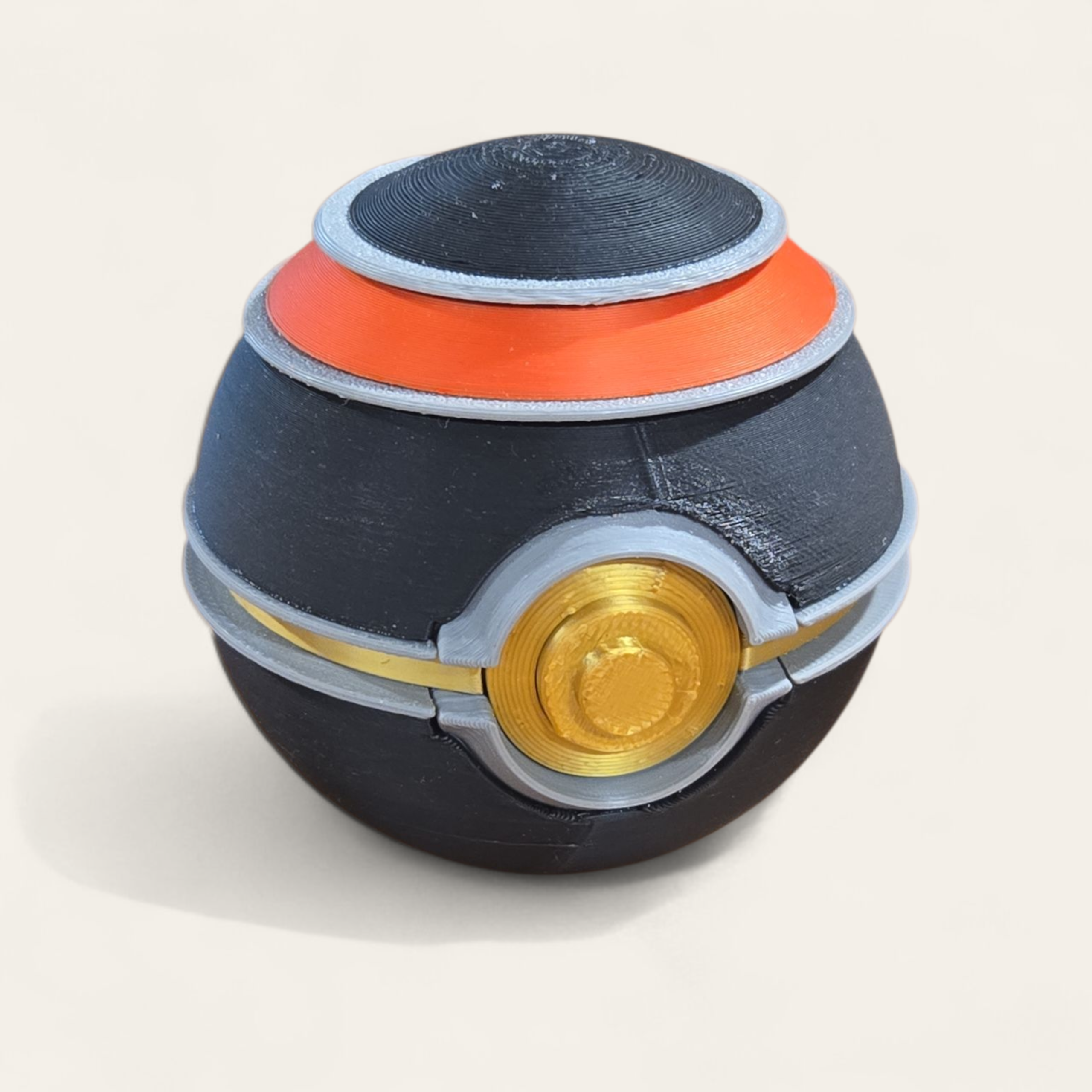 Black and gold Poké Ball with luxe detailing, inspired by the Luxury Ball