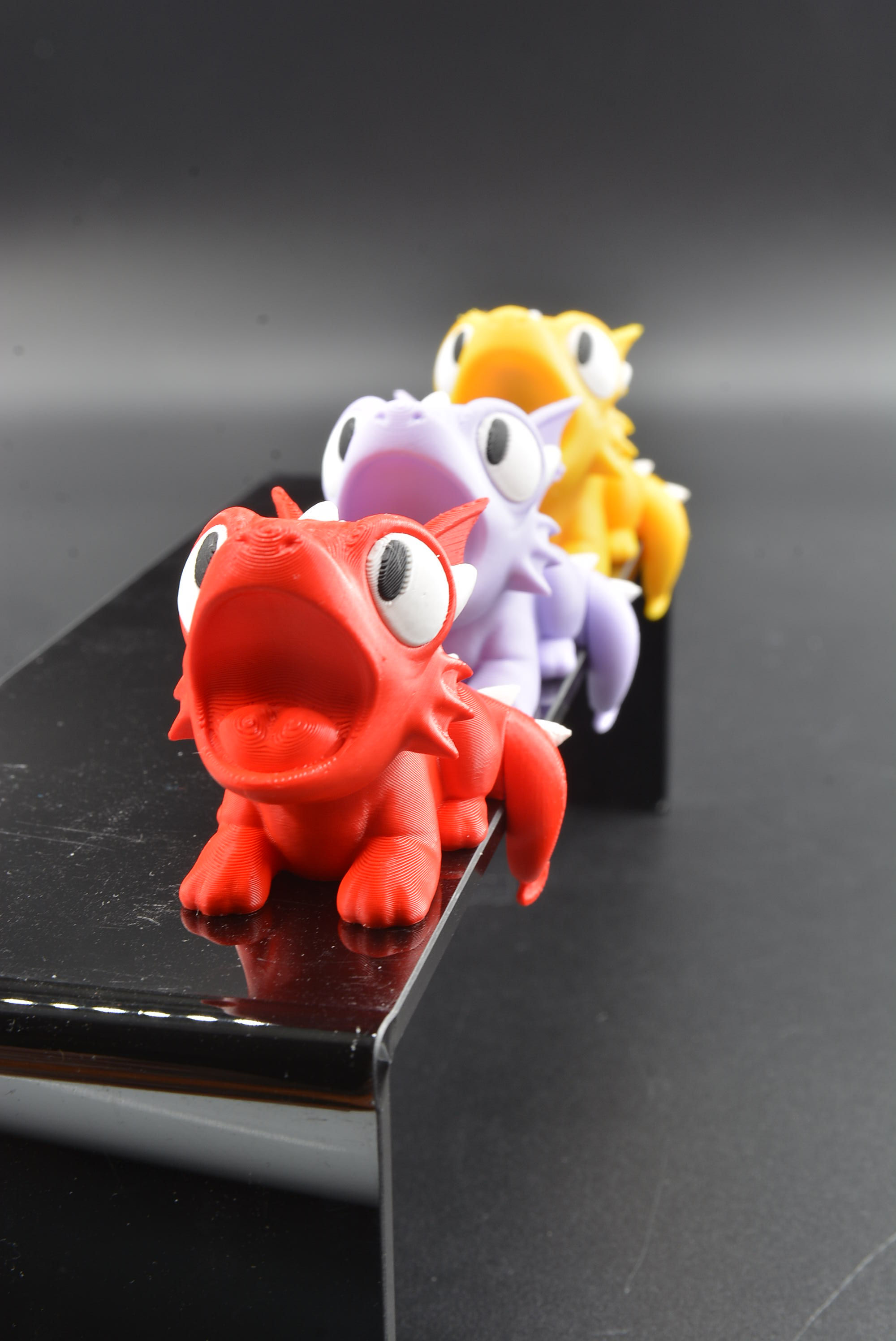 Full‑color Chompy Monitor bobble head desk mate.
