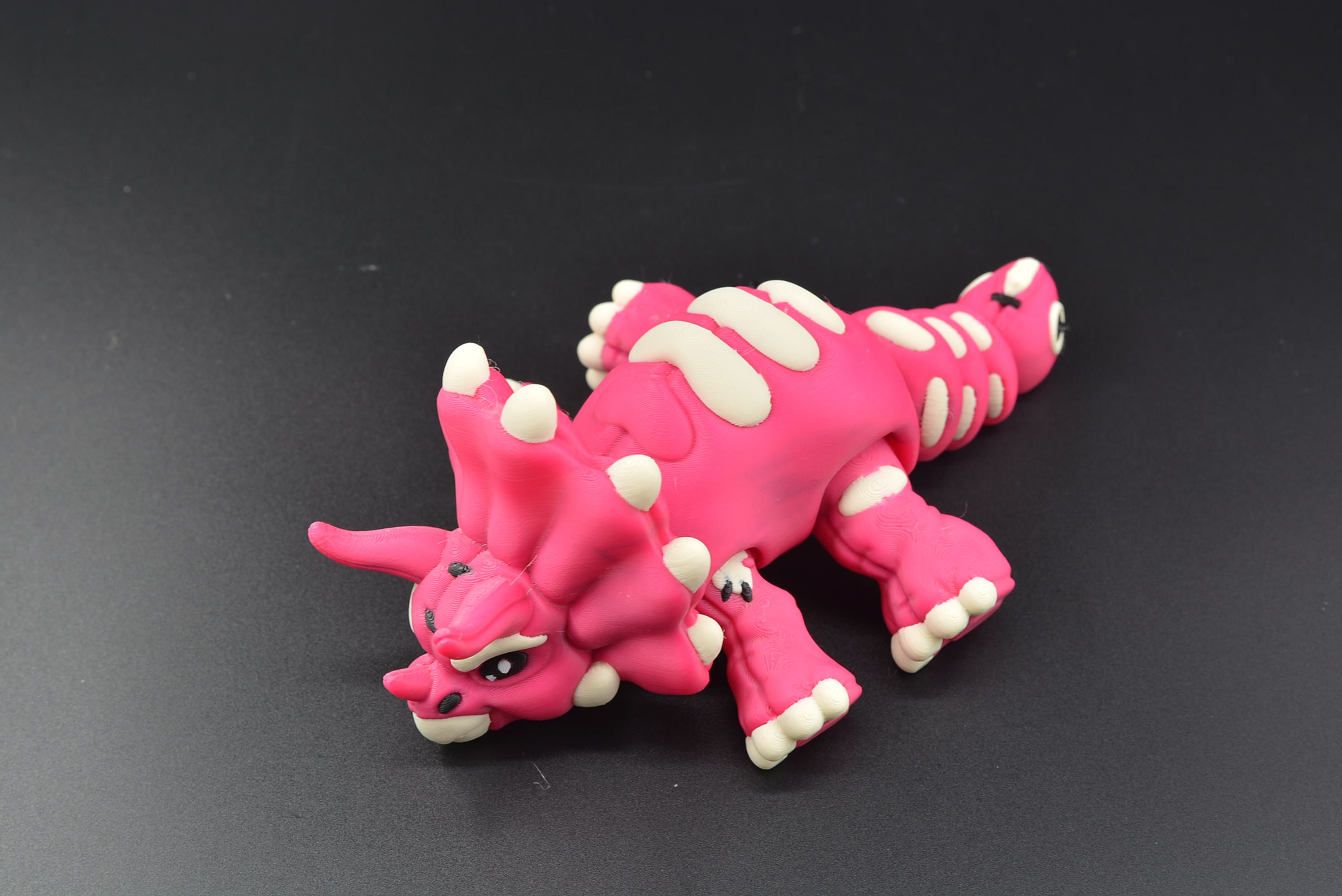3D printed stuffed‑look dinosaur flexi
