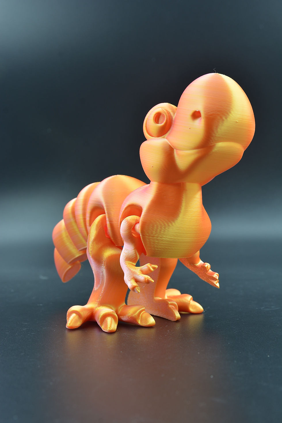 T‑Rex flexi figure with articulated movement and wiggly dinosaur design