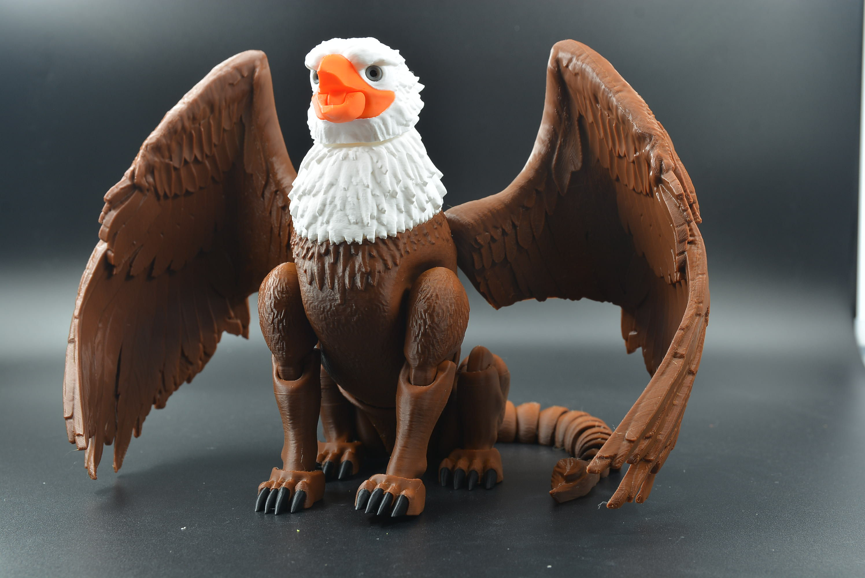 Full‑color flexi Griffin with articulated wings, lion body, and detailed feathered sculpting